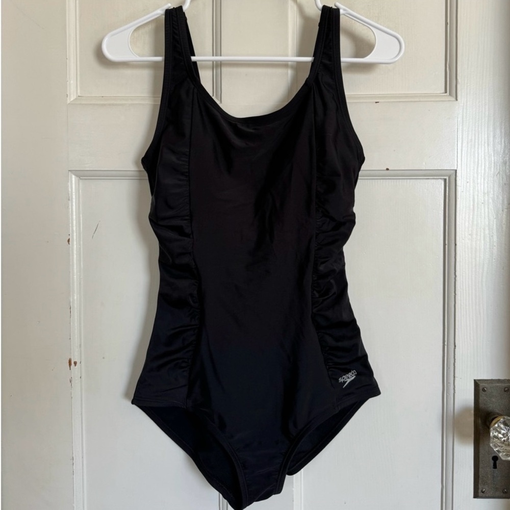 Speedo black side shirred one piece swimsuit size medium. Excellent condition.